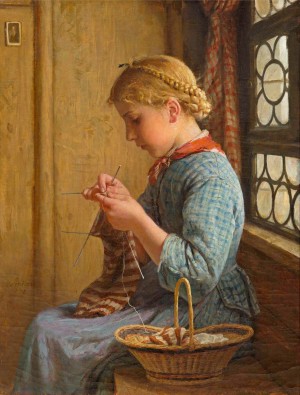 A young girl knitting
